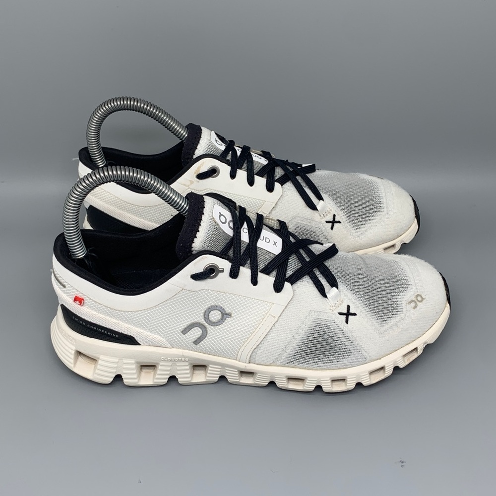 On Running White and Black Athletic Shoes